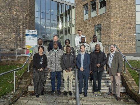 Group of people standing outside campus