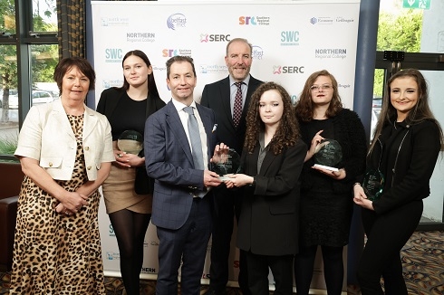 Group of students and staff with awards